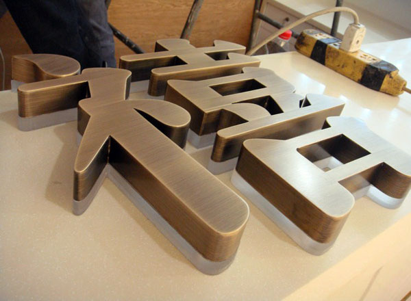 custom bronze Logo sign backlit 